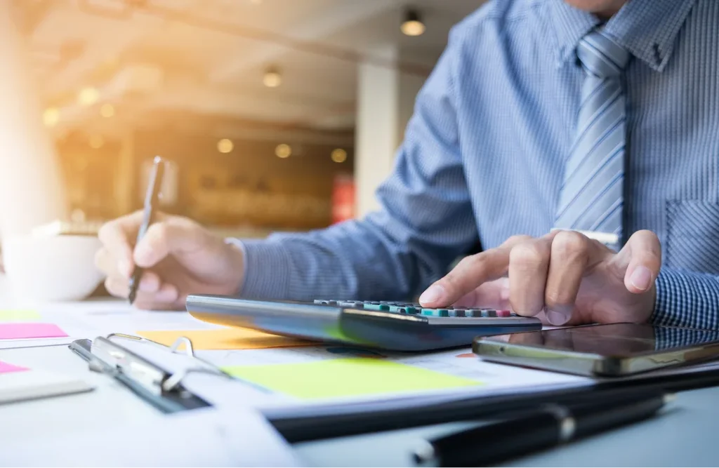 Tax professional running numbers on a calculator