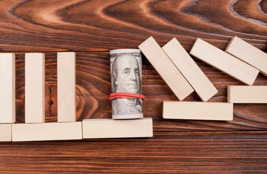 A roll of cash bracing a line of falling