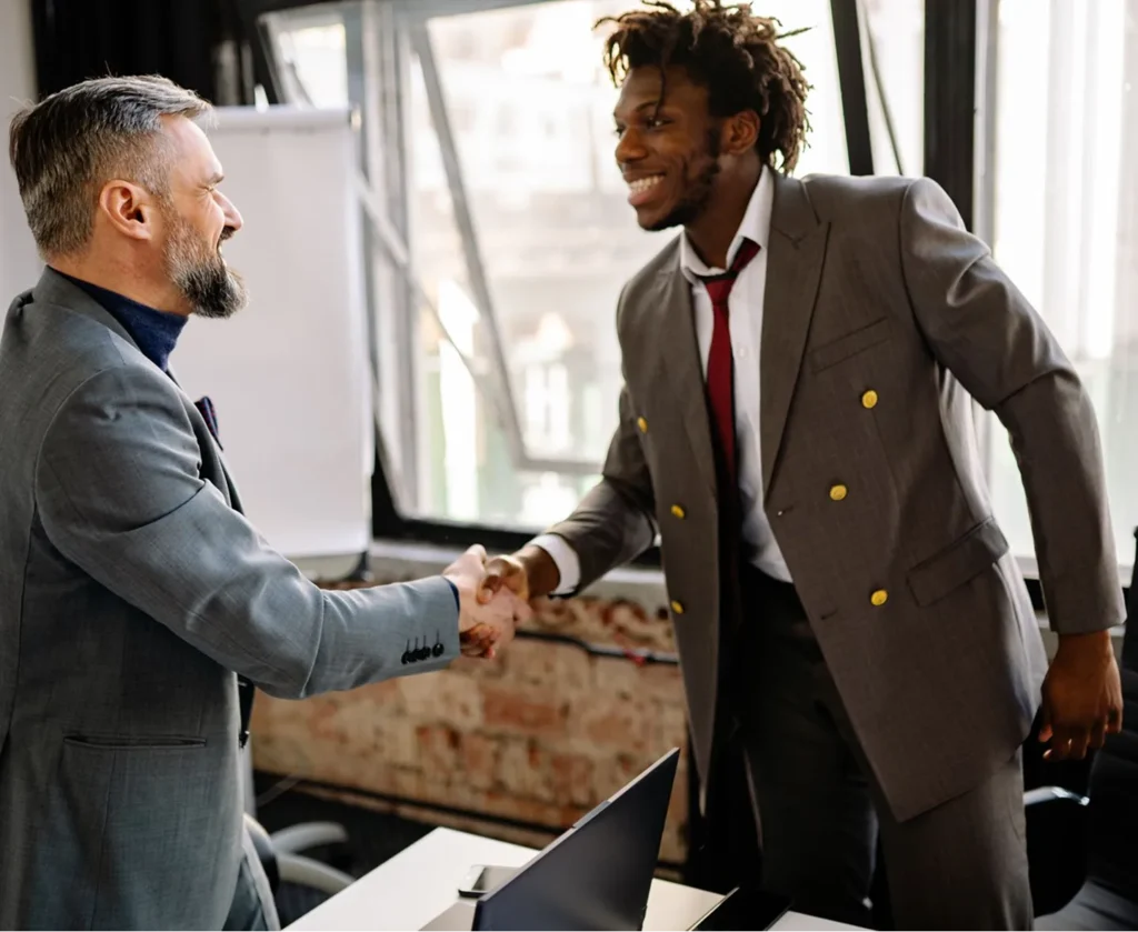 Two business people shaking hands