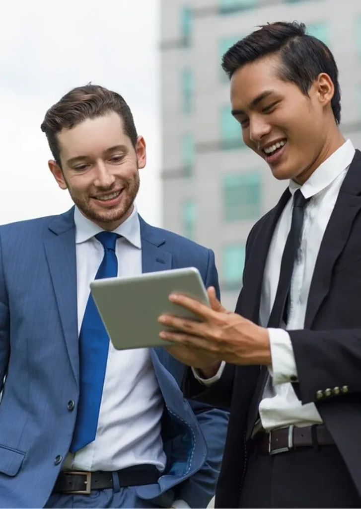 Two advisors reviewing figures on a tablet