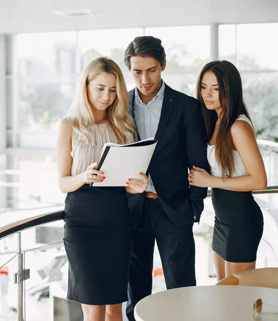 Three professionals reviewing financial statements