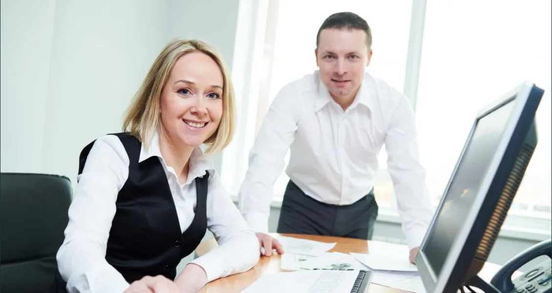 Tax team at a desk covered with financial documents